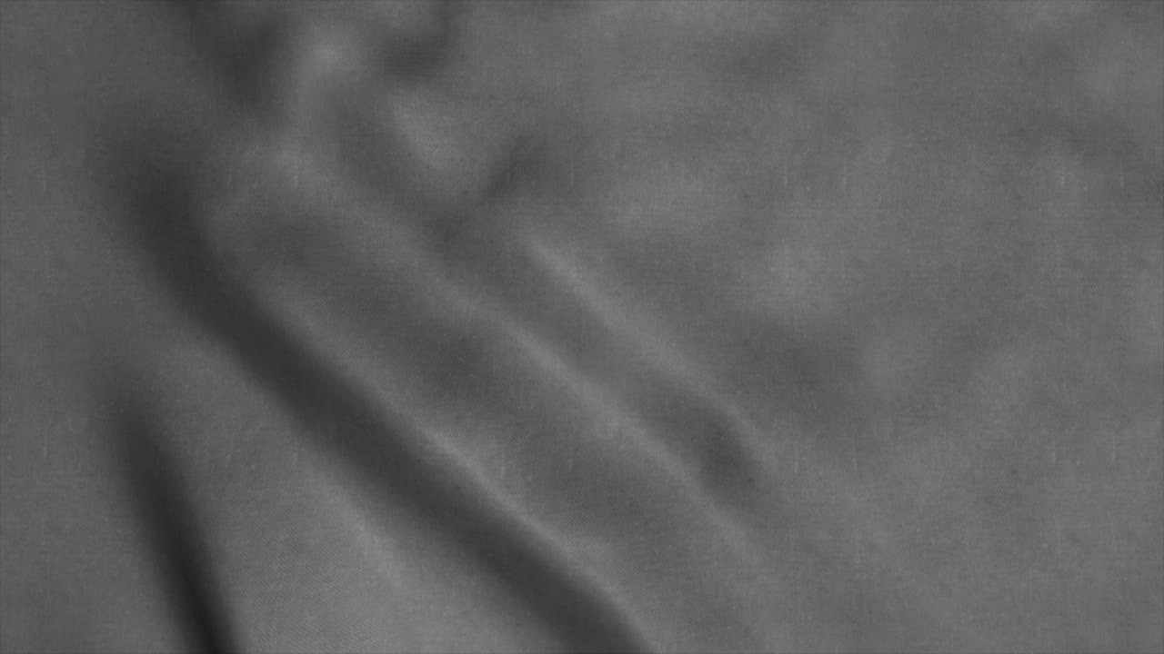 Neutral gray fabric background waving in the wind. 4K