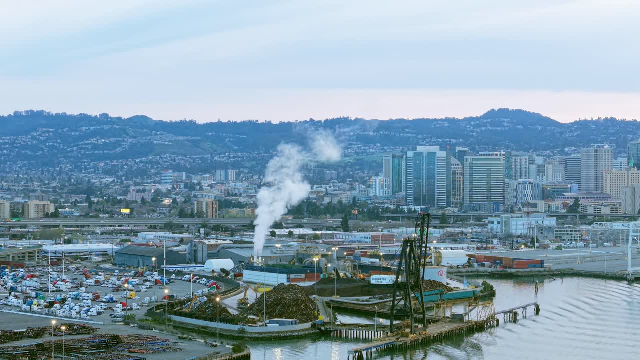 From above, the cranes and containers form a mechanical ballet across the waterfront landscape.