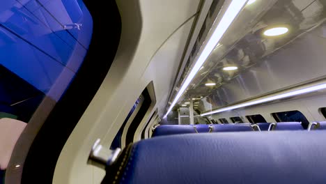 interior of a moving and almost empty dutch train