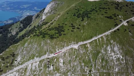 rack railway train climbing to schafberg summit in salzkammergut, upper austria.