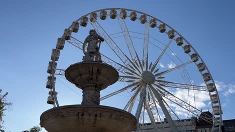 budapest, hungary - the budapest eye ferris wheel is spinning at deak square