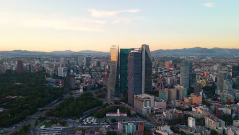 drone shot around the bbva tower, the ritz - carlton and the banorte high rise, in chapultepec, la condesa, mexico city, in central america - orbit, aerial view