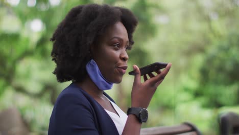 African-american-woman-wearin-face-mask-in-park