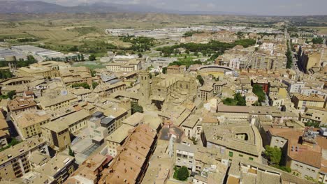 panoramic aerial view of a historic european city with a grand cathedral and bullring