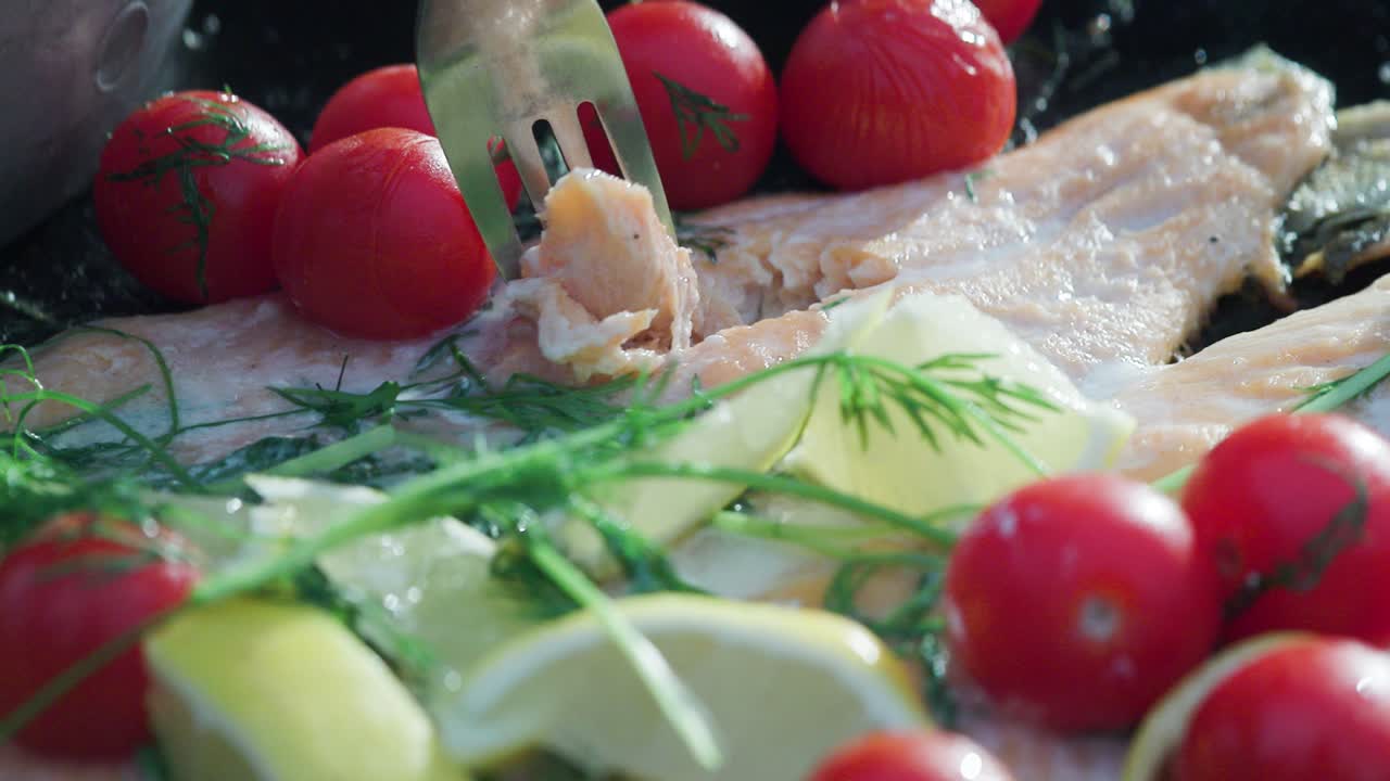 Close up of fork and mountain char filet in slow motion