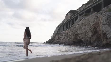 Latino-model-spending-time-in-solace-at-Platja-de-Gava-Barcelona