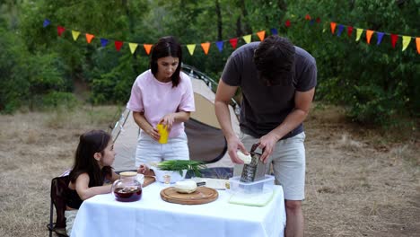 family camping trip dinner preparation