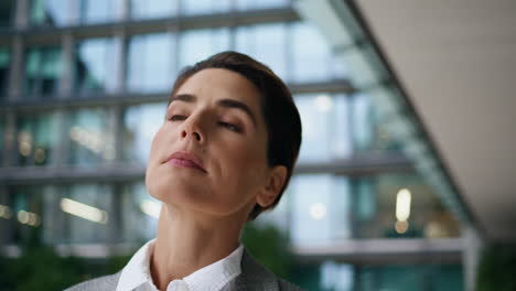 Confident-executive-walking-downtown-street-closeup.-Proud-woman-going-meeting