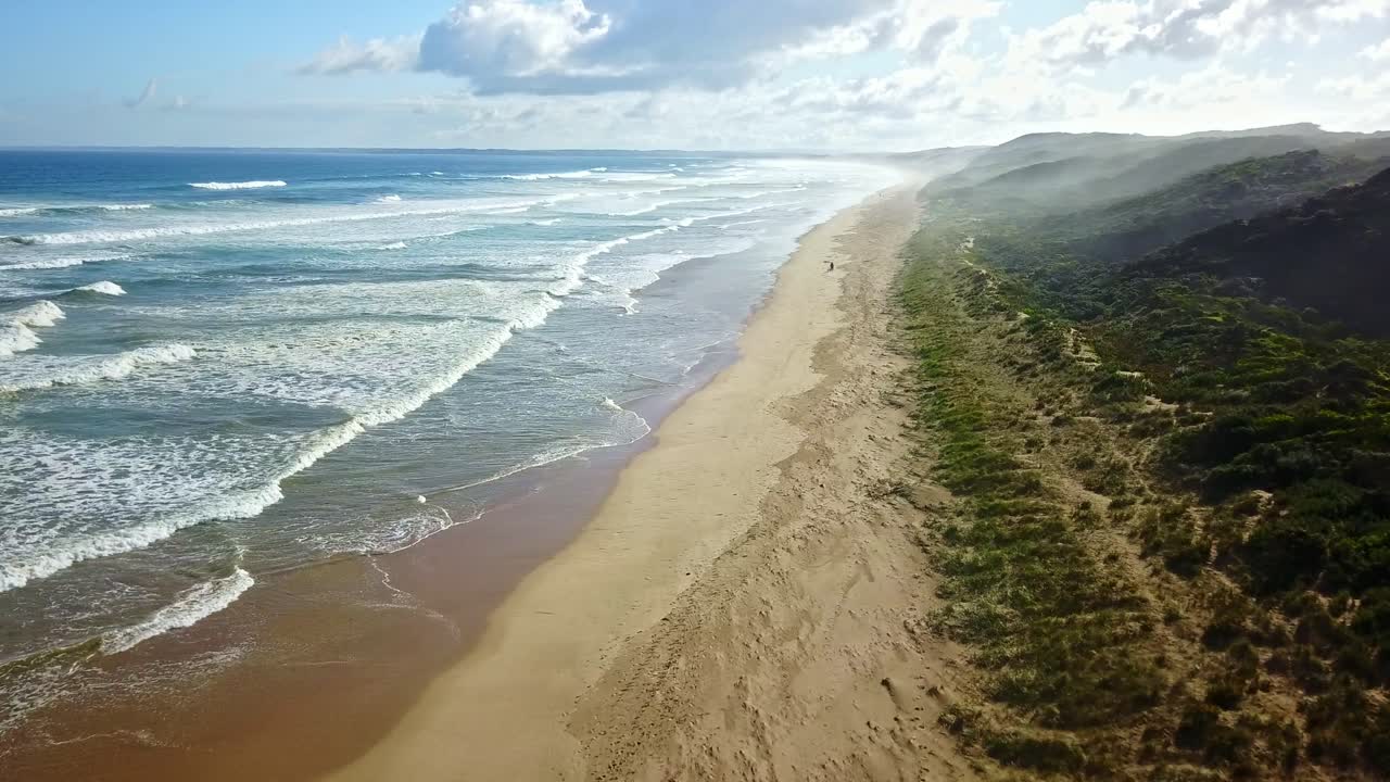 Fast aerial footage over waves and beach at Venus Bay, Victoria, Australia