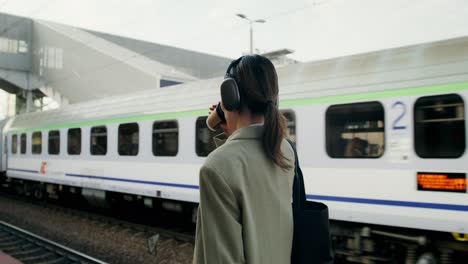 woman waiting for a train at the station