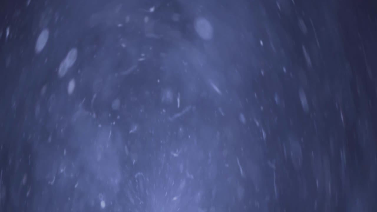 partículas de fondo azul abstracto y bokeh flotando en el espacio