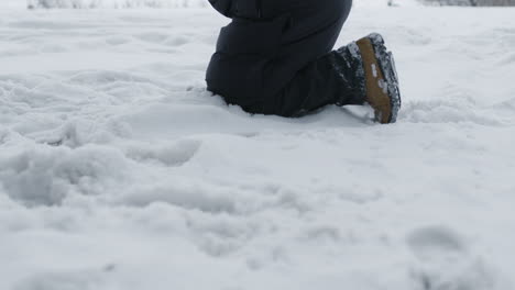 sad man falling on his knees at the street