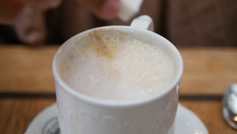 close-up of a latte with sugar