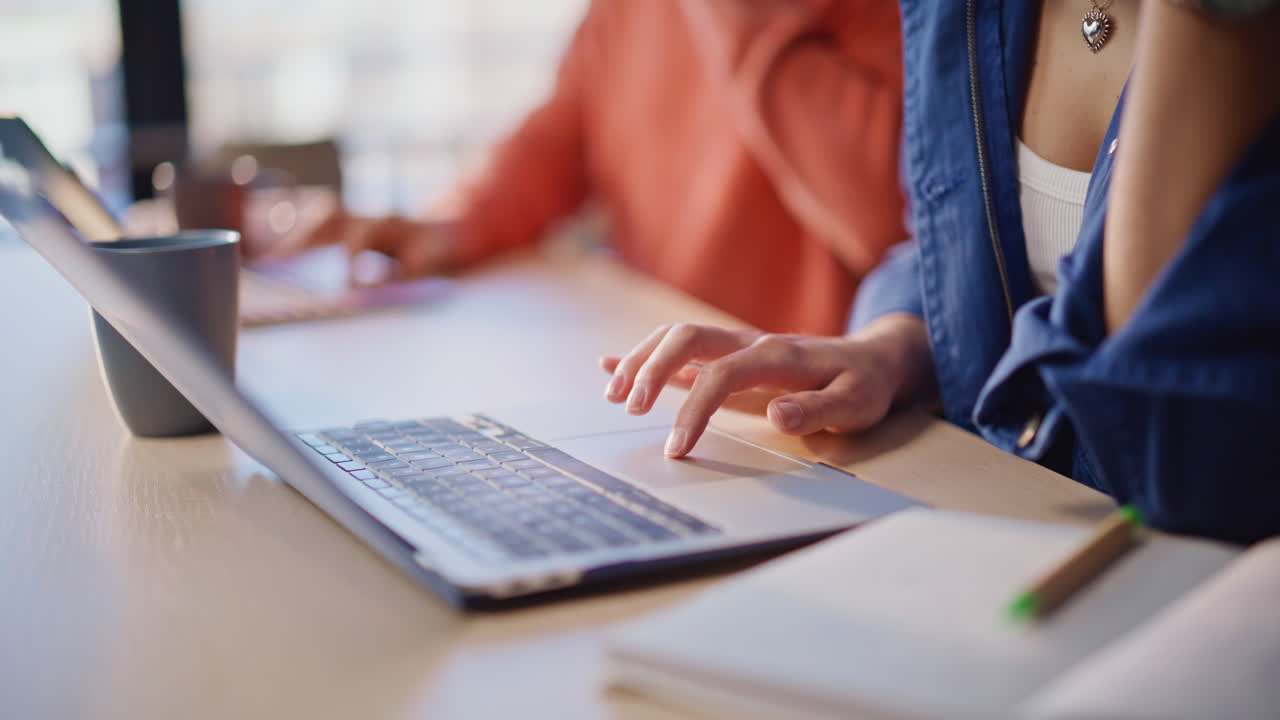 Two online managers hands typing keyboard making report at workplace closeup