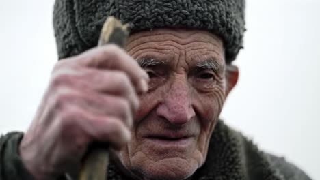 a portrait of resilience: capturing the wisdom and strength of an elderly man in two frames, reflecting a life rich in experience and heritage amidst a timeless landscape