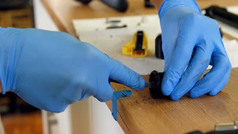 man cleaning bicycle parts on counter 4k