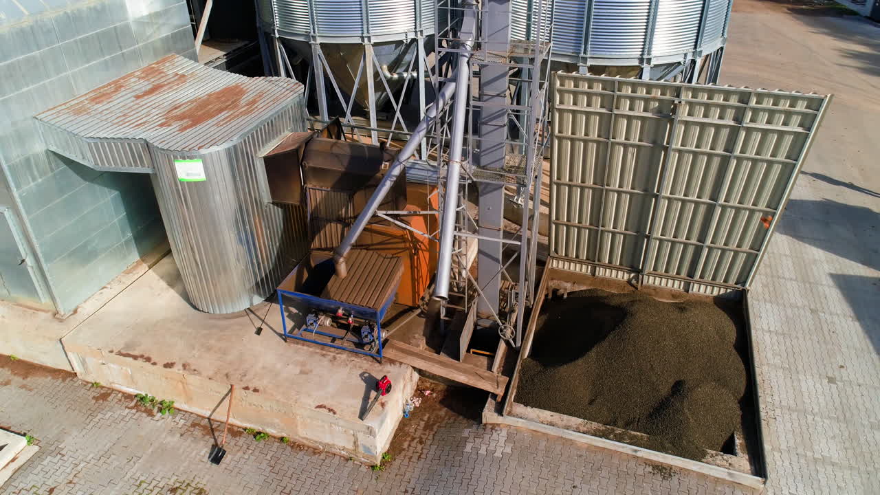 Steel towers for storing crops. Granary of feed mill built of modern metal structures