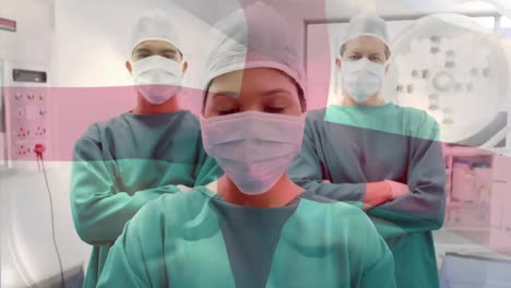 Animation-of-flag-of-england-waving-over-surgeons-in-operating-theatre