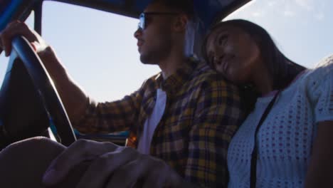 Young-couple-on-a-road-trip-in-their-pick-up-truck