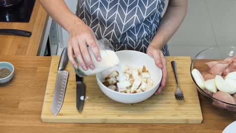 preparing a creamy chicken dish