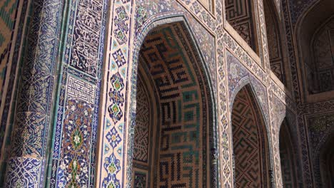 series of archways with intricate tiling in registan madrassas in samarkand, uzbekistan along the historic silk road