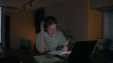 woman studying at home at night
