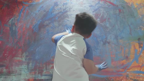 dirty little boy using hands painting art picture