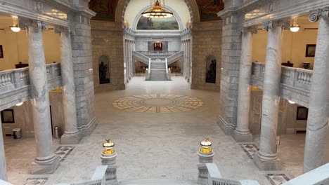 panning down empty utah state capital lobby starting from ceiling archway moving down to marble staircase