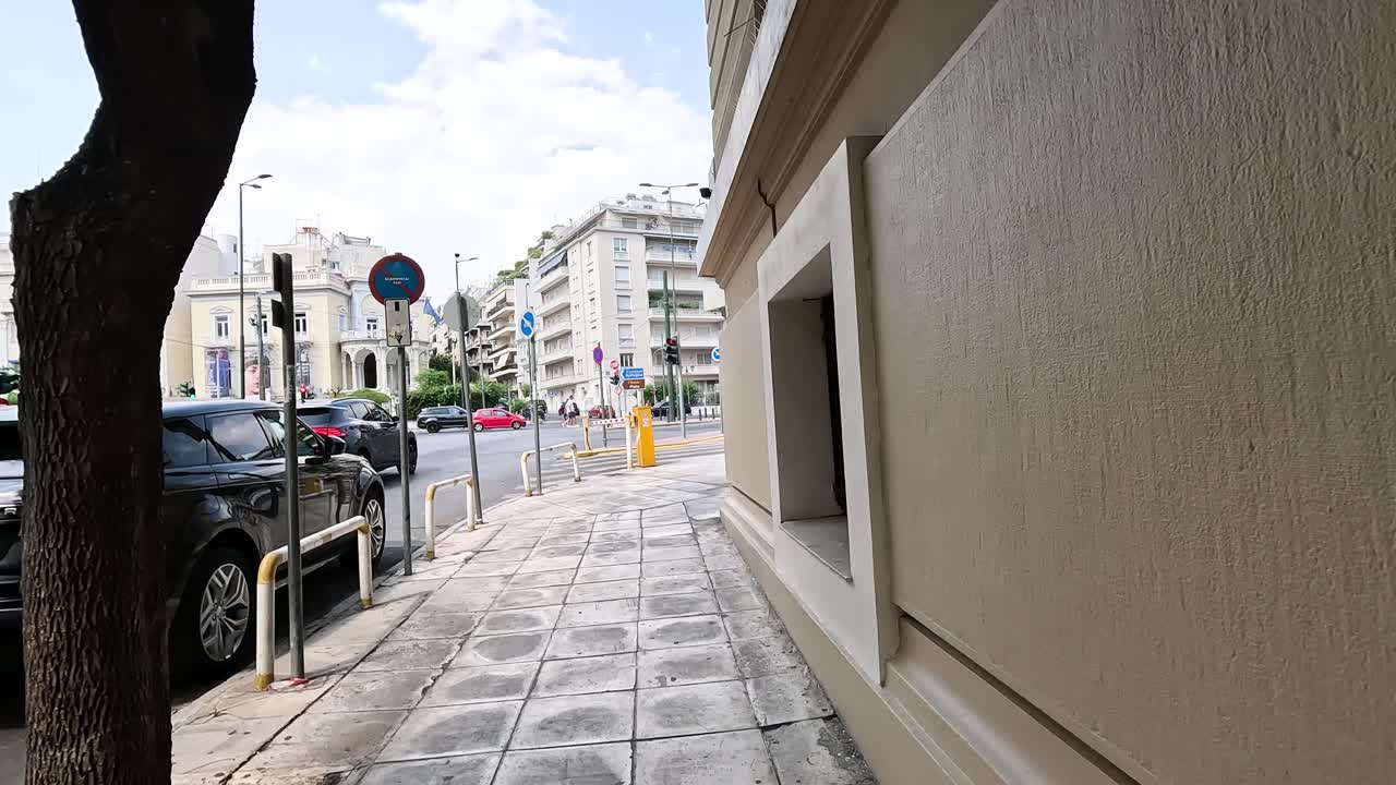 Walking towards a busy street in Athens.