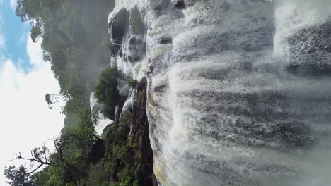 dramatic vertical aerial towards colnett waterfall, hienghene new caledonia