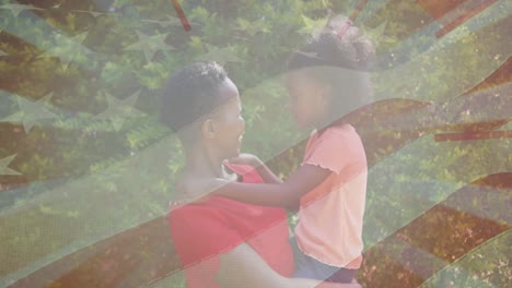 animación de la bandera de los estados unidos sobre una mujer afroamericana caucásica con su hija