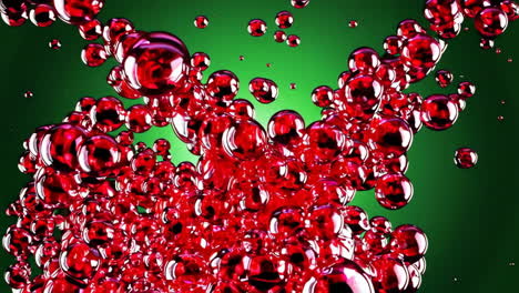 red bubbles in motion on green background