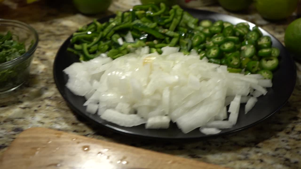 Bowl of White Onions and Green Bell Peppers.