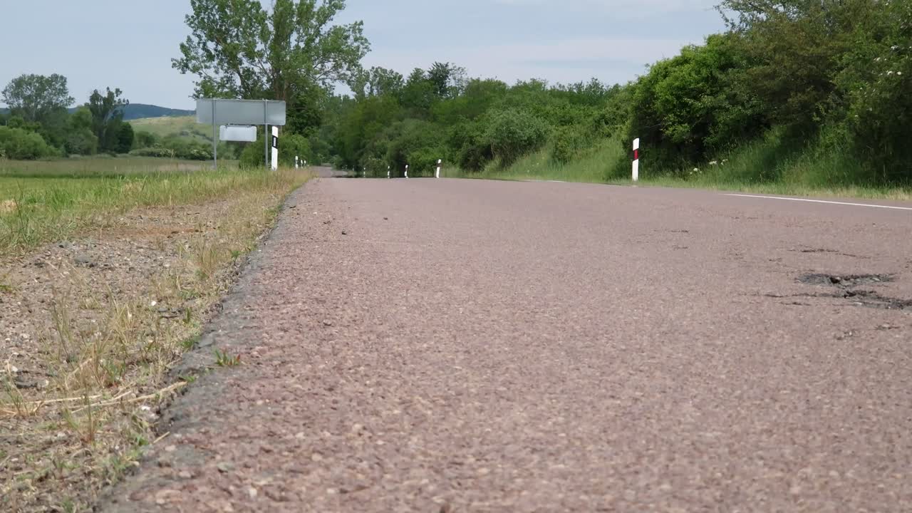 Heat haze rising from rural asphalt road in summer
