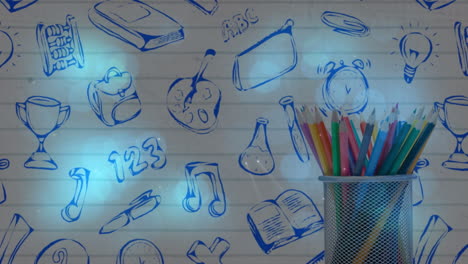 animación de lápices de colores sobre el fondo con artículos escolares