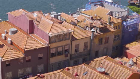 A-Shot-of-Old-Town-Rooftops-in-Porto,-Portugal-by-the-Douro-River