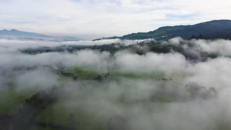 cinematic slow aerial drone flying through the clouds over the mountains in neblina, machachi, equador