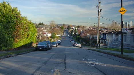 Cars-Parked-On-Both-Sides-Of-Road-In-The-Neighbourhood-Near-East-Vancouver,-BC-Canada