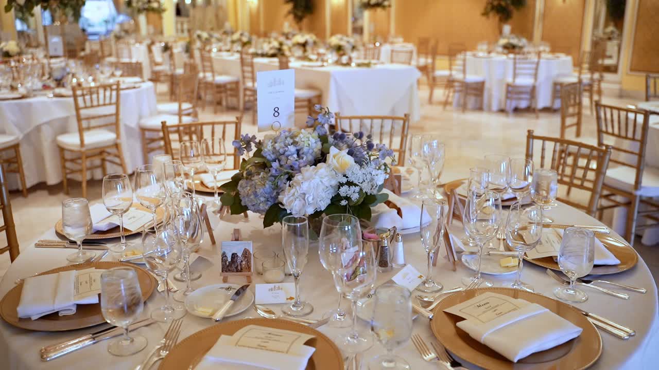 Elegant Gold Tableware Place Setting On Round Table In Wedding Venue