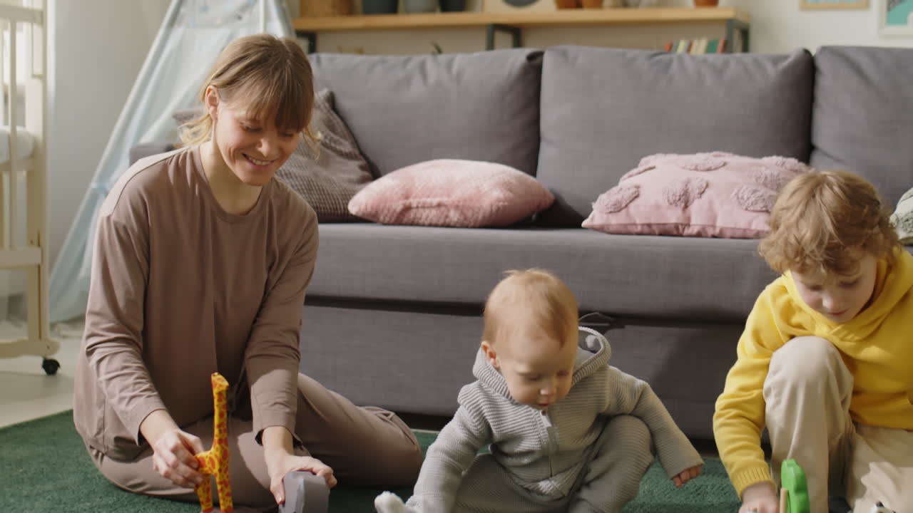 Mother Playing with Little Kids at Home
