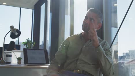 man sitting at desk in office
