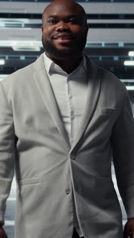 vertical video smiling employee walking in high tech data center