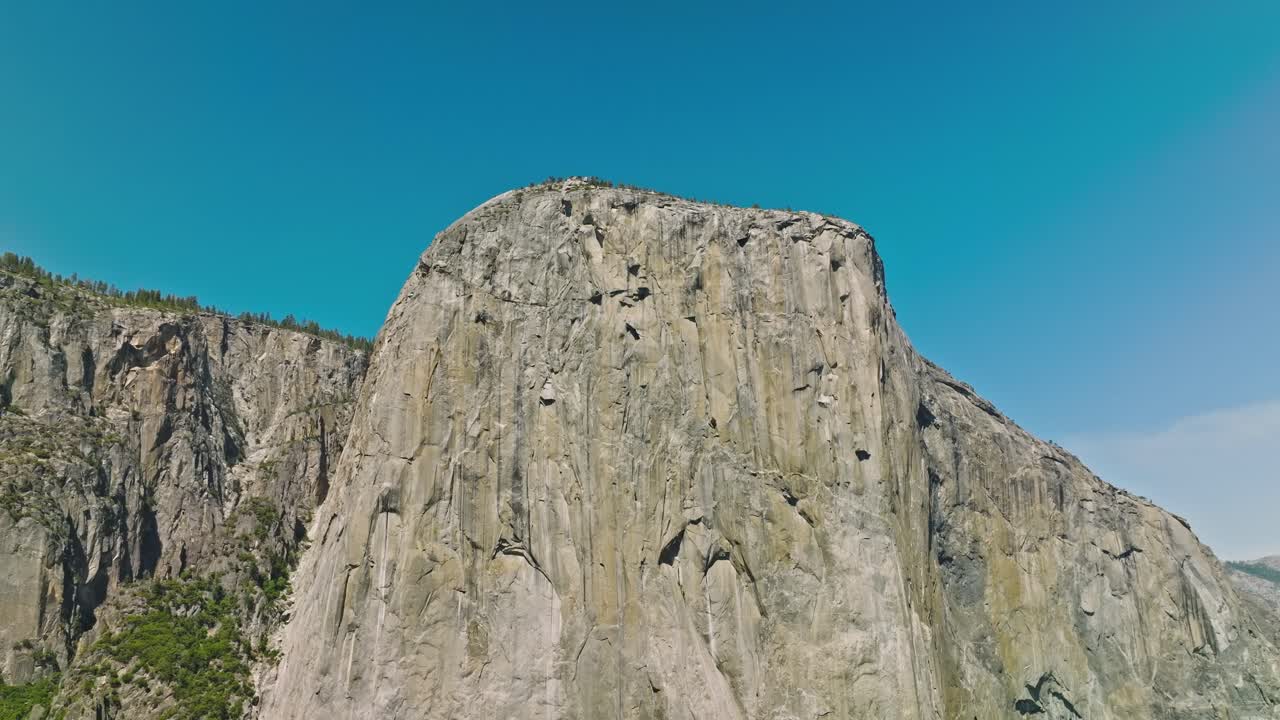 View of Yosemite Valley with evergreen forests visible in the background