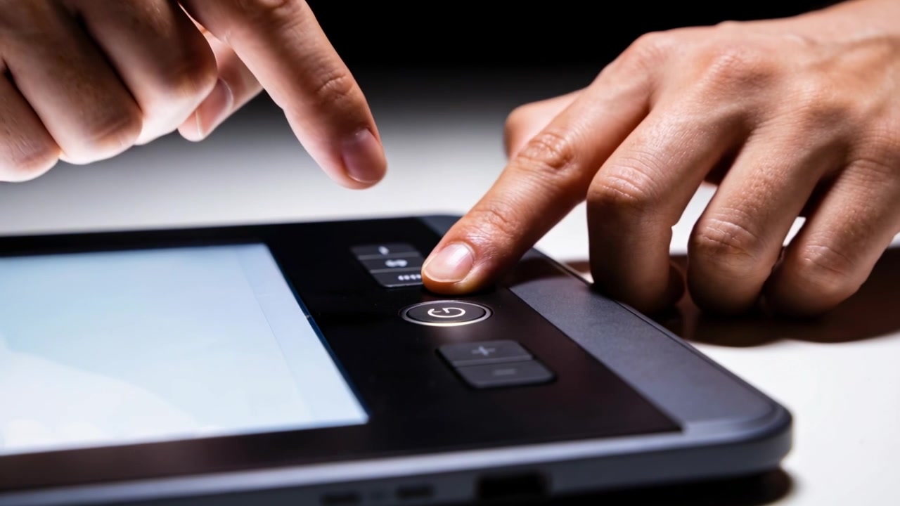 Pressing left index on round button while right reaching two buttons, switching tablet UI at desk