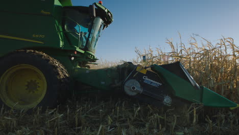 combine harvester, sunny day, slow motion