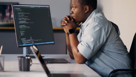 man concentrating on coding