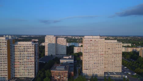 Wonderful-aerial-top-view-flight-Panel-system-building,-prefabricated-housing-complex,-Berlin-Marzahn-East-Germany-golden-hour-2023