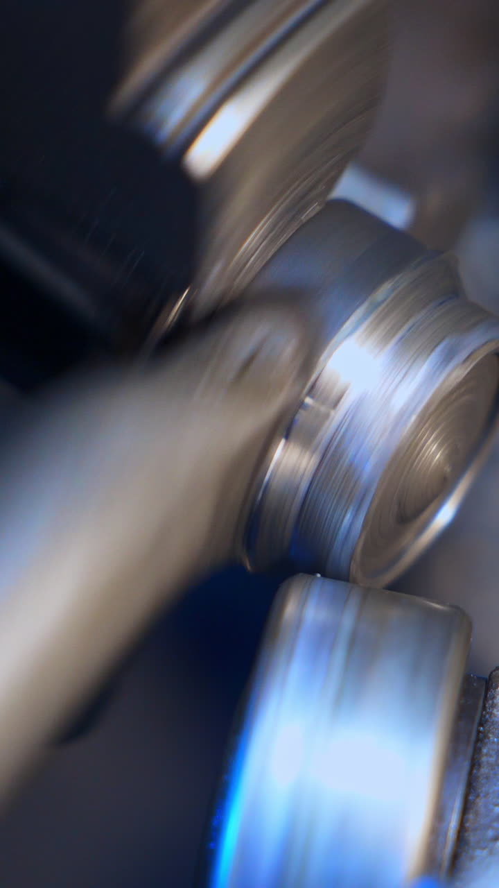The process of industrial technology concept. Close up od turning. Vertical video
