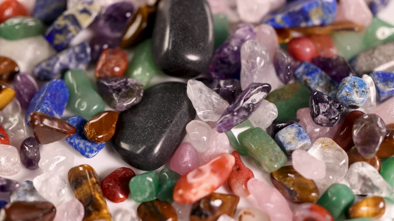 Vibrant gemstones cascade gracefully, creating a mesmerizing visual display with rich colors and dynamic movement