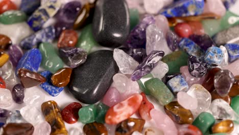 vibrant gemstones cascade gracefully, creating a mesmerizing visual display with rich colors and dynamic movement